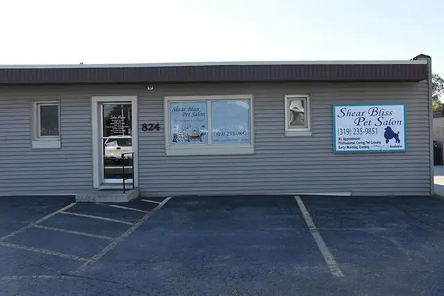The storefront of Shear Bliss Pet Salon with the 824 street number on the sign